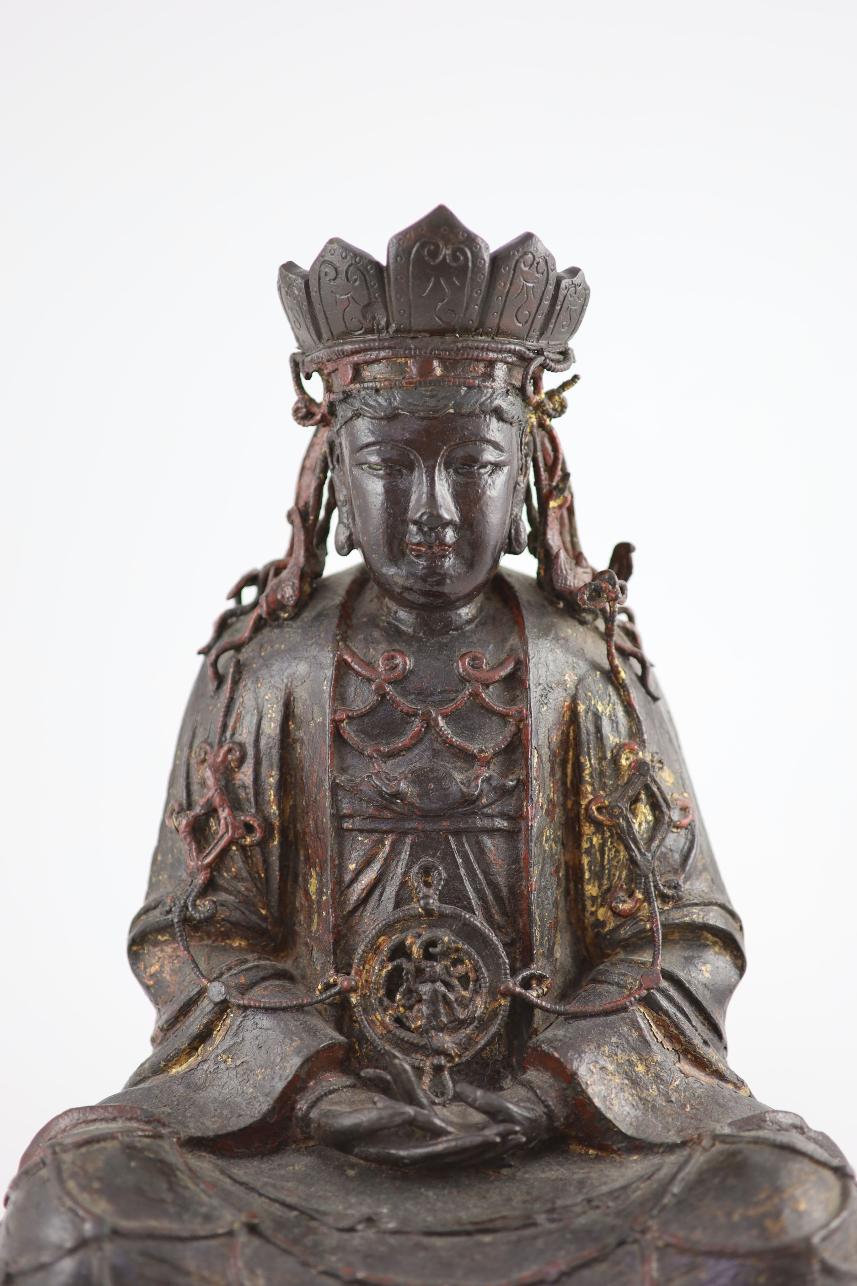 A large Chinese Ming bronze figure of a Bodhisattva, 16th/17th century, 41.5cm high, minor losses